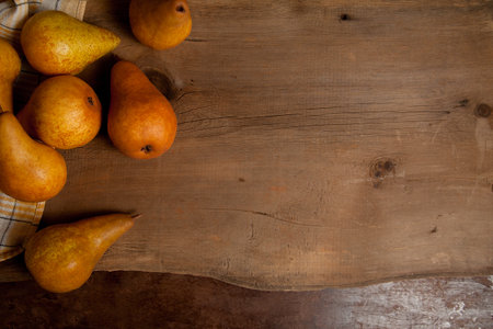 Fruit background image. Ripe juicy pear fruits on vintage wooden background.の写真素材