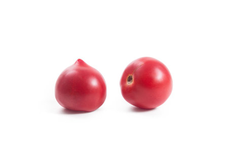 Whole ripe juicy pink tomatoes with soft shadow isolated on white background. Vegetables collection on white.の写真素材