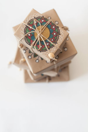 Gifts wrapped in kraft paper. The packaging ornament mandala.の写真素材