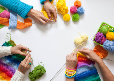 Women crochet and knitting from colored yarn. View from above.の写真素材