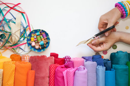 Rolls of bright colored fabric on a white background.の写真素材