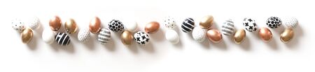 Top view of multi-colored large and small eggs. Nordic style