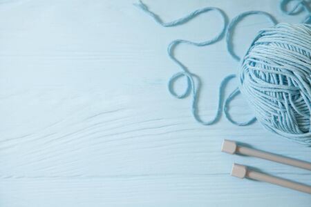Yarn in cold colors and knitting accessories. Female hobby concept.の写真素材