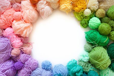Color wheel of yarn. Rainbow and spectrum. White background. Threads of different colors.の写真素材
