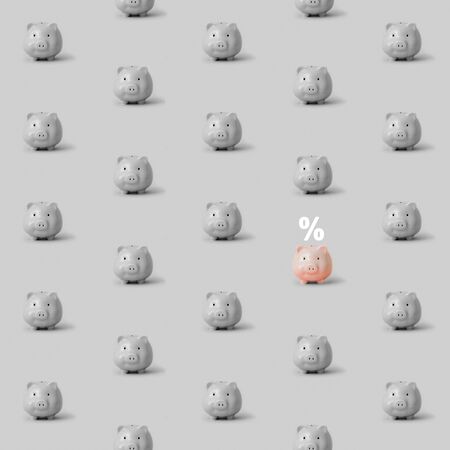 Background with monochrome piggy banks and one pinkの写真素材