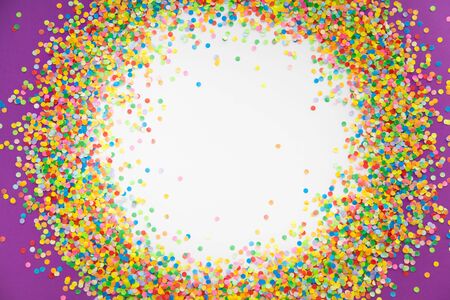 Colorful Confetti in front of color Background.の写真素材