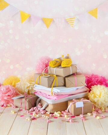 Gifts and pink decorations for girl baby shower indoors.の写真素材