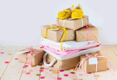 Gifts and pink decorations for girl baby shower indoors.の写真素材