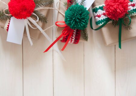 Christmas gifts on a white background. Fir branches.