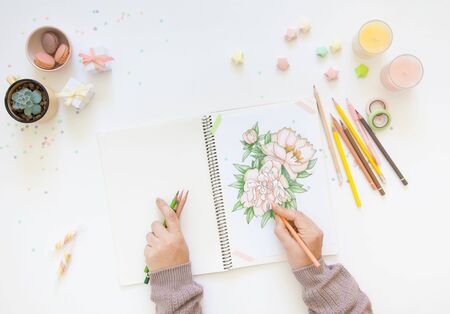 concept of women's hobbies and leisure. drawing with simple colored pencils