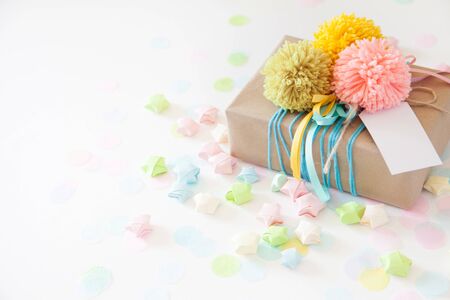 Colored gift boxes with colorful ribbons and pompon. white background. Gifts for Christmas or a birthday.の写真素材