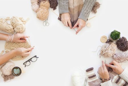 Women crochet and knitting from colored yarn. View from above.の写真素材