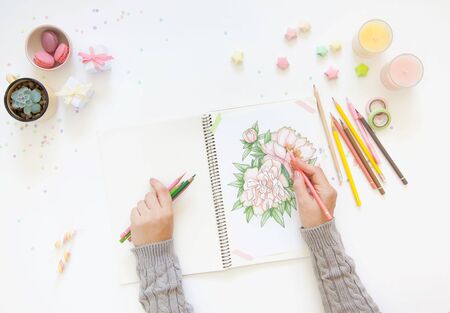 sketch drawing with colored pencils. flowers peonies. Candles, gifts, tea and white backgroundの写真素材