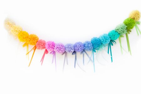 Pompons of colored yarn. White background. Bright colours.の写真素材