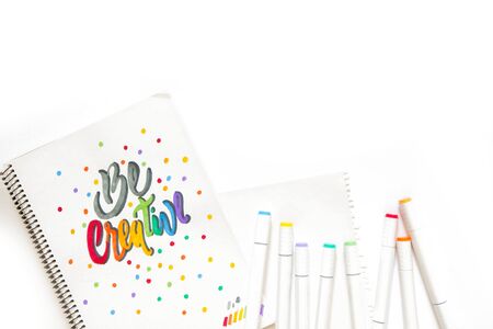 Lettering. Words Be creative, written with colored markers on white paper. Felt-tip pens.