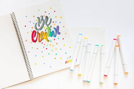 Lettering. Words Be creative, written with colored markers on white paper. Felt-tip pens.の写真素材