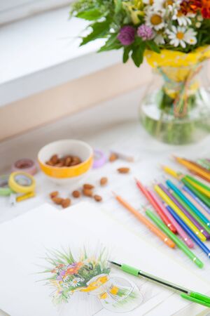 Picture / sketch of a bouquet of wildflowers in a transparent vase on a white background. Colour pencils. Glasses.の写真素材