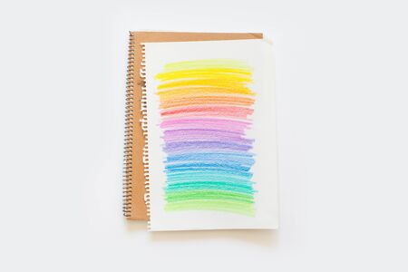 Rainbow painted with colored pencils. iridescent background.
