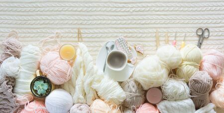 Yarn in a basket of beige and neutral, natural tones, knitting and crocheting. Spokes, succulent,...