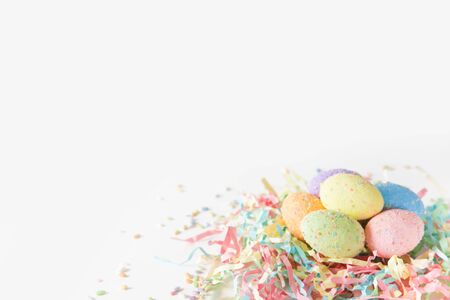 Painted Easter eggs in a birds nest. Pink background. Pastel shades.の写真素材