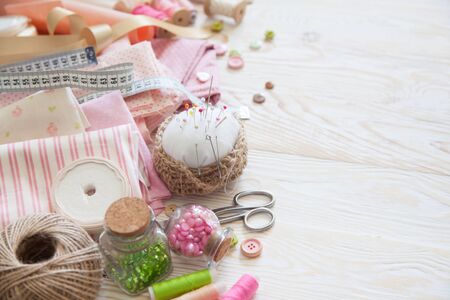 Colored fabric, yarn, thread. Colored materials for creative work on the table. Do needlework....