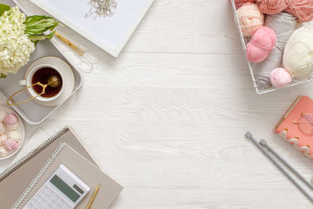 Accessories for needlework and knitting. Yarn, knitting needles, scissors. Womens diary and tea with...