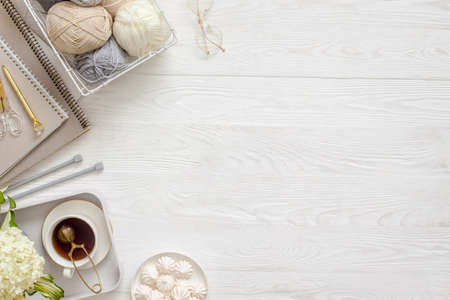 Accessories for needlework and knitting. Yarn, knitting needles, scissors. Womens diary and tea with...