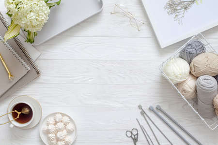 Accessories for needlework and knitting. Yarn, knitting needles, scissors. Womens diary and tea with...