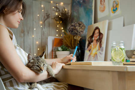 Artist Creative Designer Illustrator Graphic Skill Concept. On the table are brushes, paints, sketchbooks, and blank canvases. Workplace.の写真素材