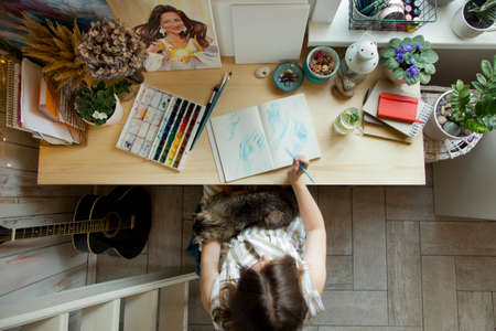 Artist Creative Designer Illustrator Graphic Skill Concept. On the table are brushes, paints, sketchbooks, and blank canvases. Workplace.の写真素材