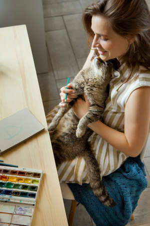 Artist Creative Designer Illustrator Graphic Skill Concept. On the table are brushes, paints, sketchbooks, and blank canvases. Workplace.の写真素材