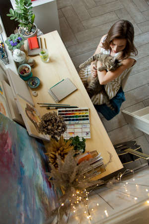 Artist Creative Designer Illustrator Graphic Skill Concept. On the table are brushes, paints, sketchbooks, and blank canvases. Workplace.の写真素材