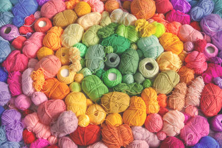 Colored balls and skiens of yarn for knitting. Top view. Rainbow colors. Color radial, round gradient.の写真素材