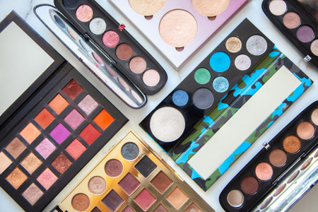 Flat lay of various of waterproof contour, eyeshadow palette collection with vivid and pastel colorsの写真素材