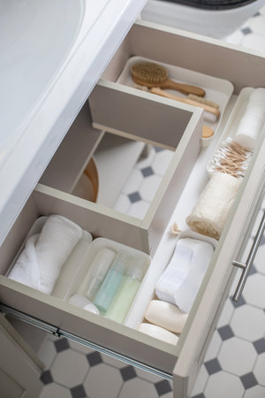 Marie Kondos method organization of bathroom amenities. Tidying up or storage household spaceの写真素材