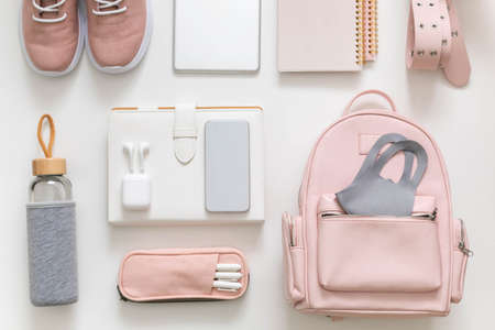 Female backpack stationery, clothes. Student bag storage organization. Concept of back to school