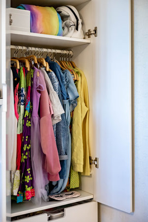 Wardrobe with perfect order clothes shades. Storage clothes. Teenager girl clothes.の写真素材