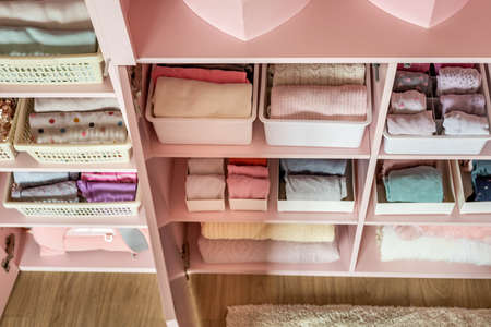 Female kid pink closet with comfortable vertical storage clothes organization case boxの写真素材