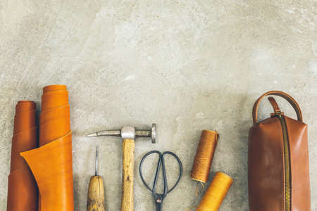 Top view materials and instruments on cutting mat for chopping measurement leatherwork details