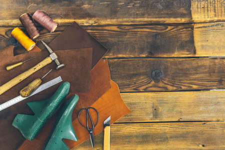 Top view materials and instruments on cutting mat for chopping measurement leatherwork details