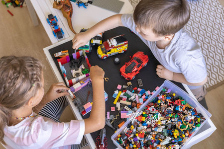 Khabarovsk, Russia, August 26, 2022. Children constructing toy cars and use Lego Classicのeditorial素材