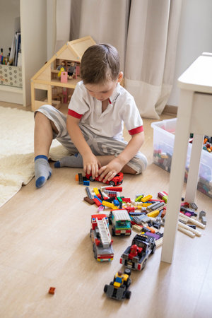 Khabarovsk, Russia, August 02, 2022. Top view baby boy playing and sorting Lego Classic piecesのeditorial素材