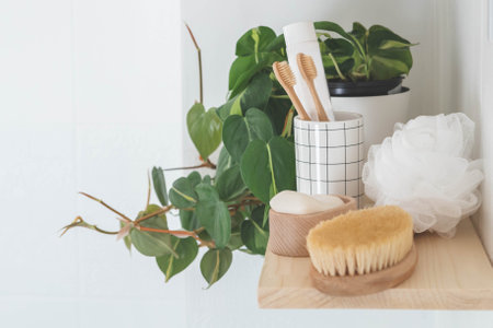 Bathroom wooden shelves eco friendly body care tools with potted plant neatly arrangement storageの写真素材