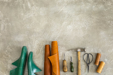 Top view materials and instruments on cutting mat for chopping measurement leatherwork detailsの写真素材
