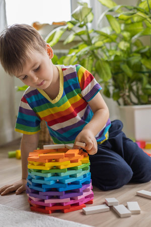 Baby boy construction colored wooden cubes block brick circle tower shape Montessori materialの写真素材
