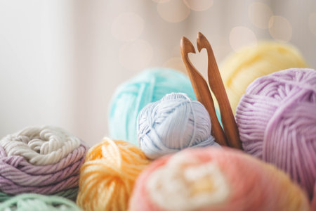 Cozy homely atmosphere. Female hobby knitting. Yarn pastel multicolor in a basket.の写真素材