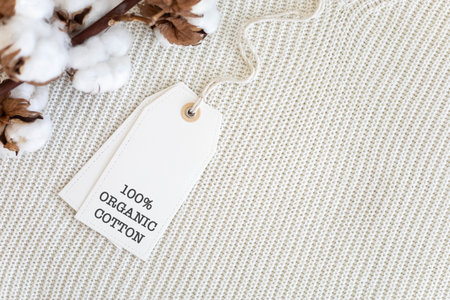 Knitted clothing labeled 100% organic cotton.の写真素材