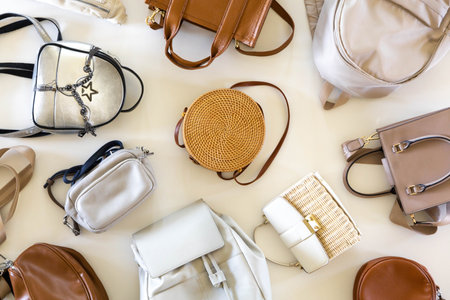 Trendy fashionable womens bags in neutral beige colors. White background.の写真素材