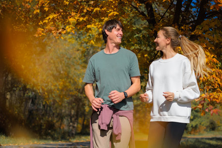 A young couple does cardio training, stretching of the body and jointsの写真素材