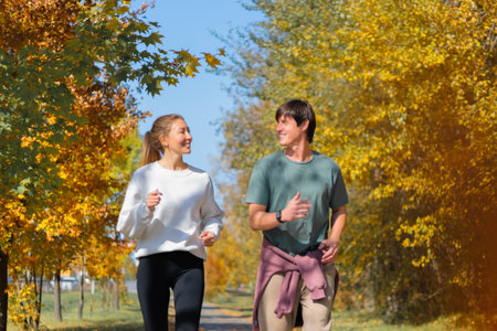 Full body profile couple young two friends strong athletic sportswoman athlete woman man 30 yearsの写真素材